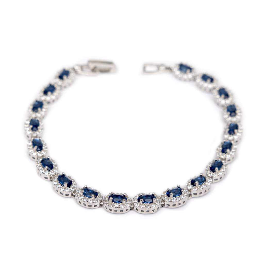 Sterling Silver tennis bracelet with oval shape blue sapphire CZ stones.