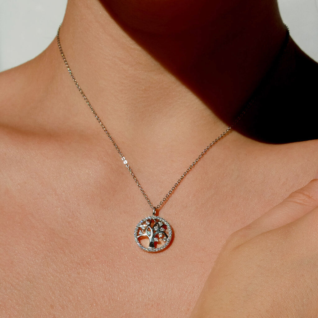 A circle tree of life necklace encrusted with details cubic zirconia stones. The sterling silver chain is an adjustable chain so ideal for all neck sizes.
