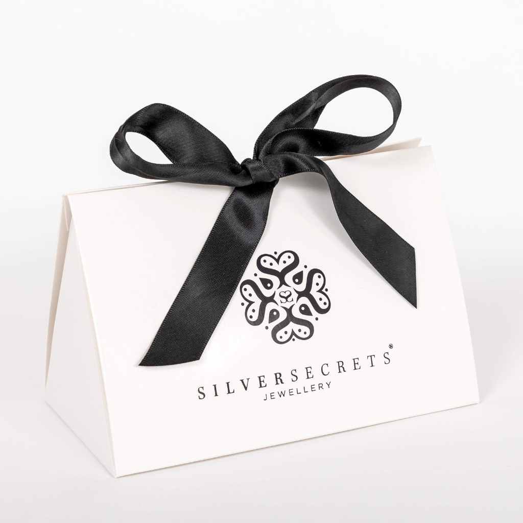 Triangle 3D Shape box in glossy white with black satin ribbon bow on top.
