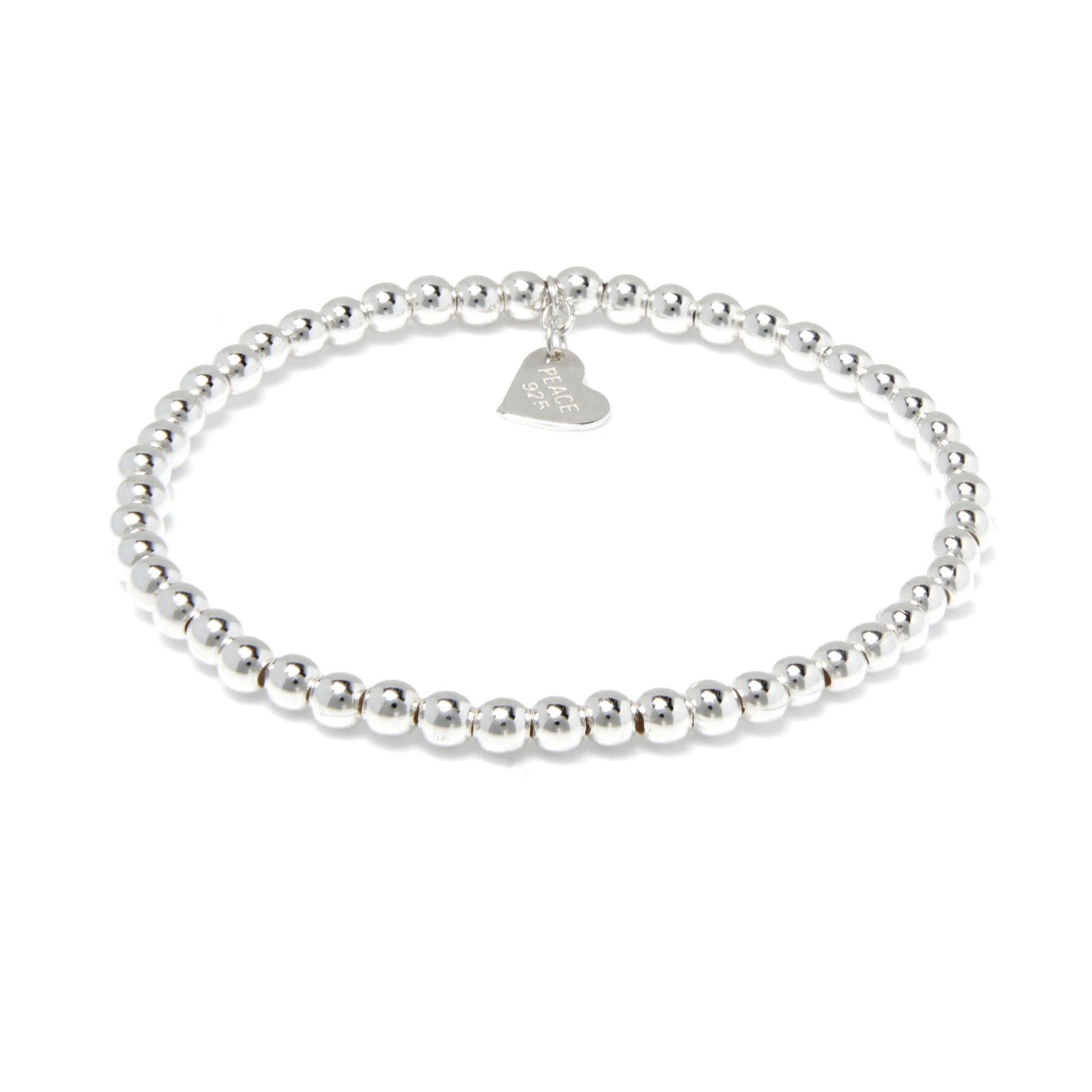 Sterling Silver bracelet with continuous 4mm balls featuring a flat heart charm. A timeless bead bracelet with high polish finish.