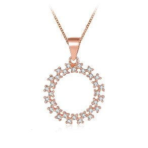 Rose gold necklace with a stunning circle charm encrusted with cubic zirconia stones.