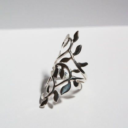 Stylish polished silver leaf ring that makes a statement by climbing up and down the finger.