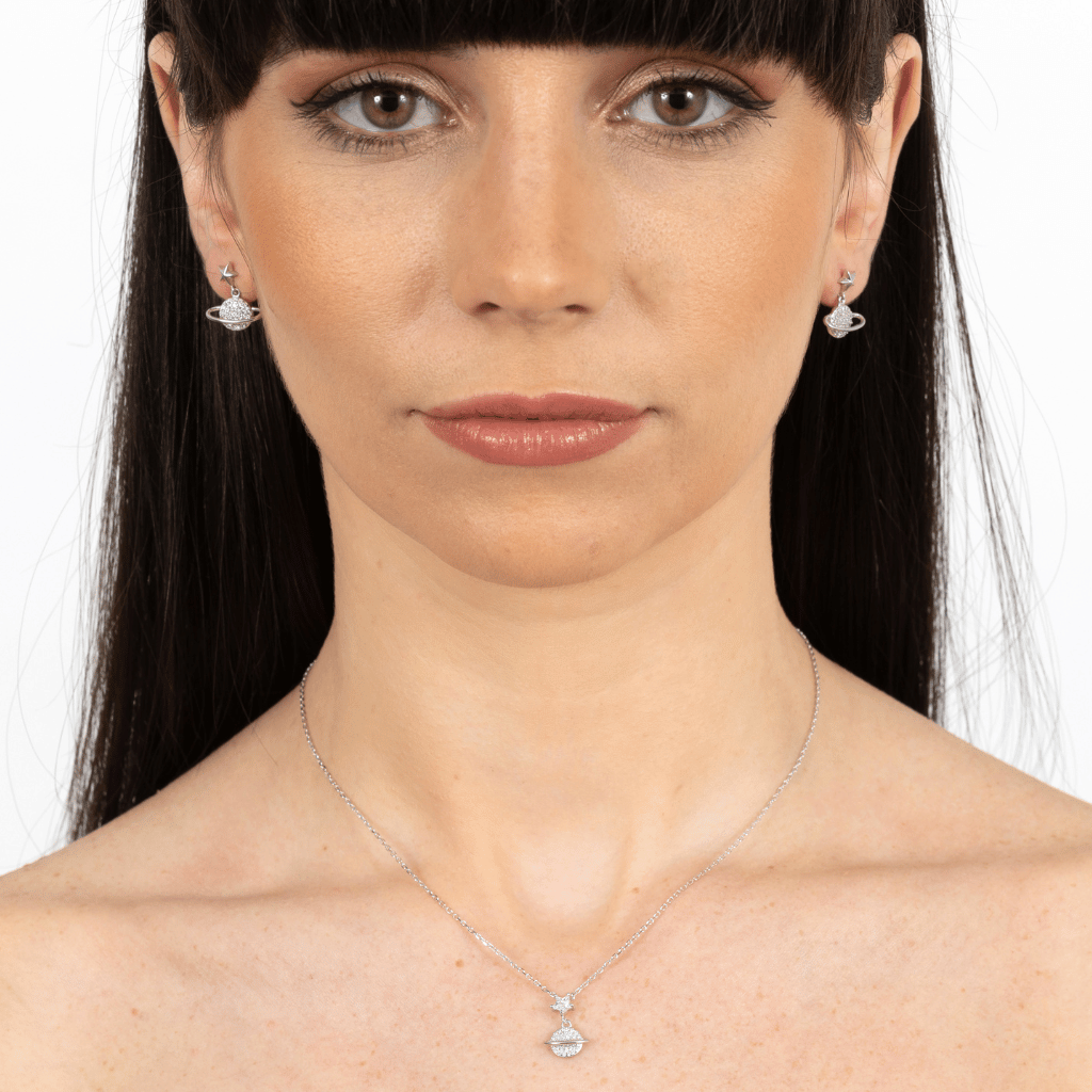 Sterling Silver necklace with a tiny star featuring a small orbit encrusted in cubic zirconia stones on a silver chain.