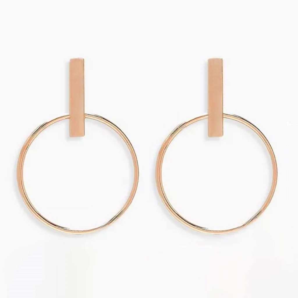 Rose gold vertical stud bar with a 30mm hoop earring with a high polish finish.