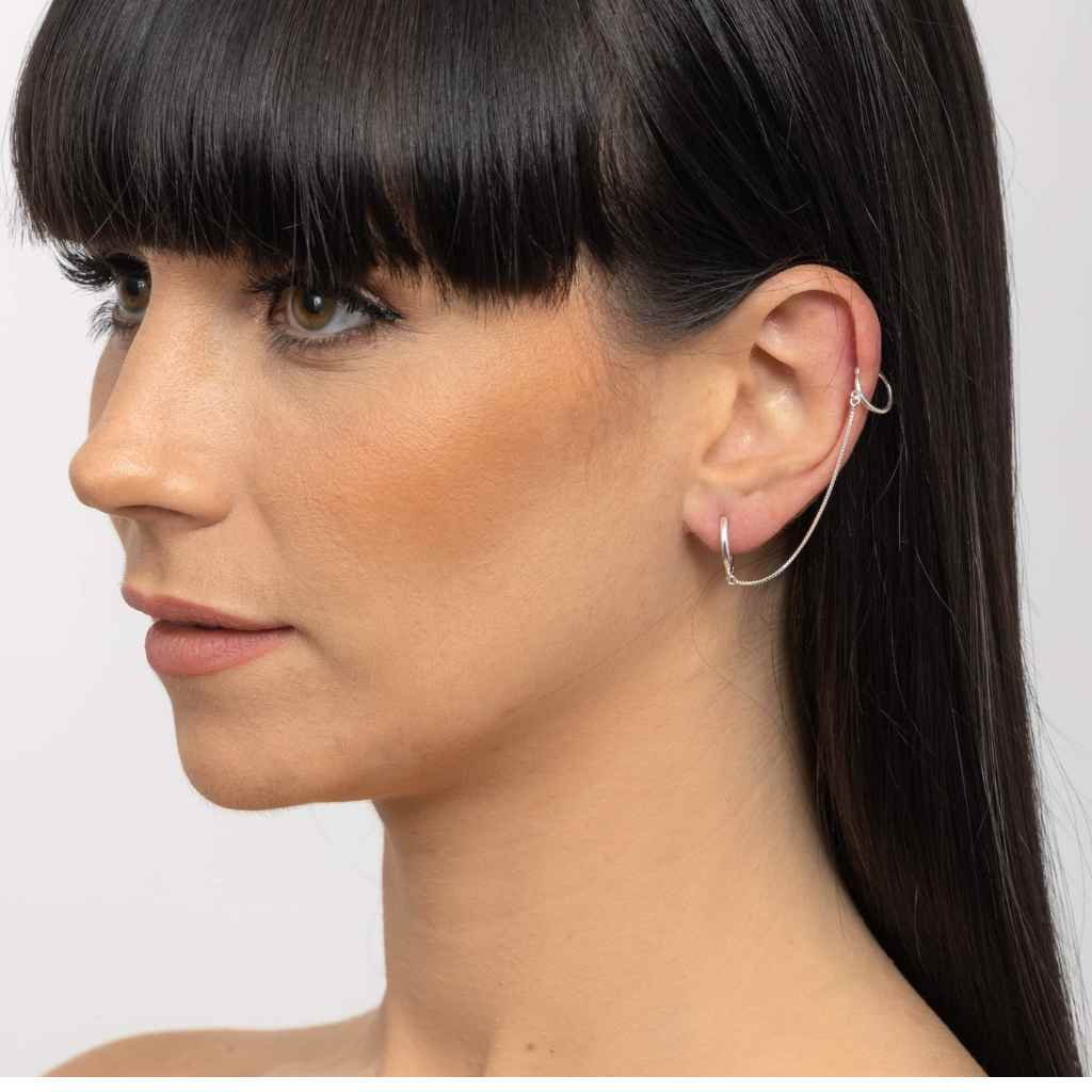 Earrings with a  hoop in the main ear with a small hoop to clip on the top of the ear in a high polish finish made from Sterling Silver.