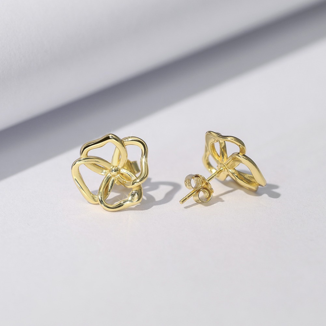 Back view of gold plated abstract bloom stud earrings with butterfly back