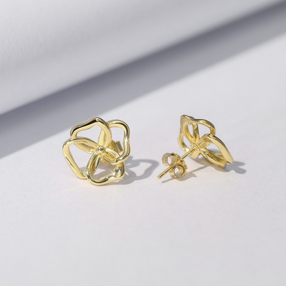 Back view of gold plated abstract bloom stud earrings with butterfly back