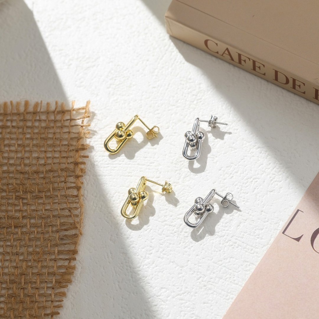 Gold and Sterling Silver Link Stud Earrings side by side