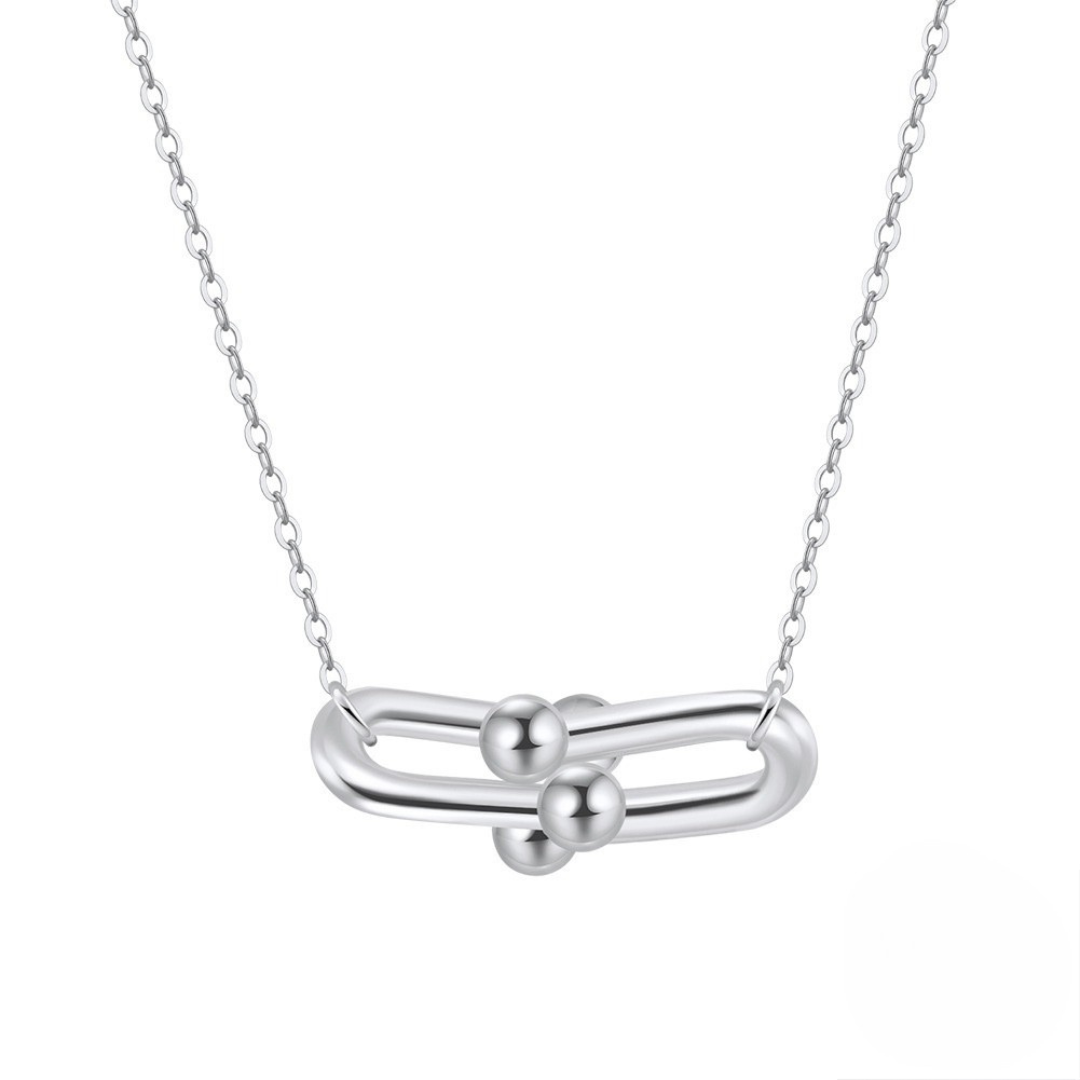 Close-up of the Sterling Silver Link Pendant Necklace, highlighting the polished double-link and orb design with a sleek rhodium finish