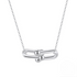 Close-up of the Sterling Silver Link Pendant Necklace, highlighting the polished double-link and orb design with a sleek rhodium finish