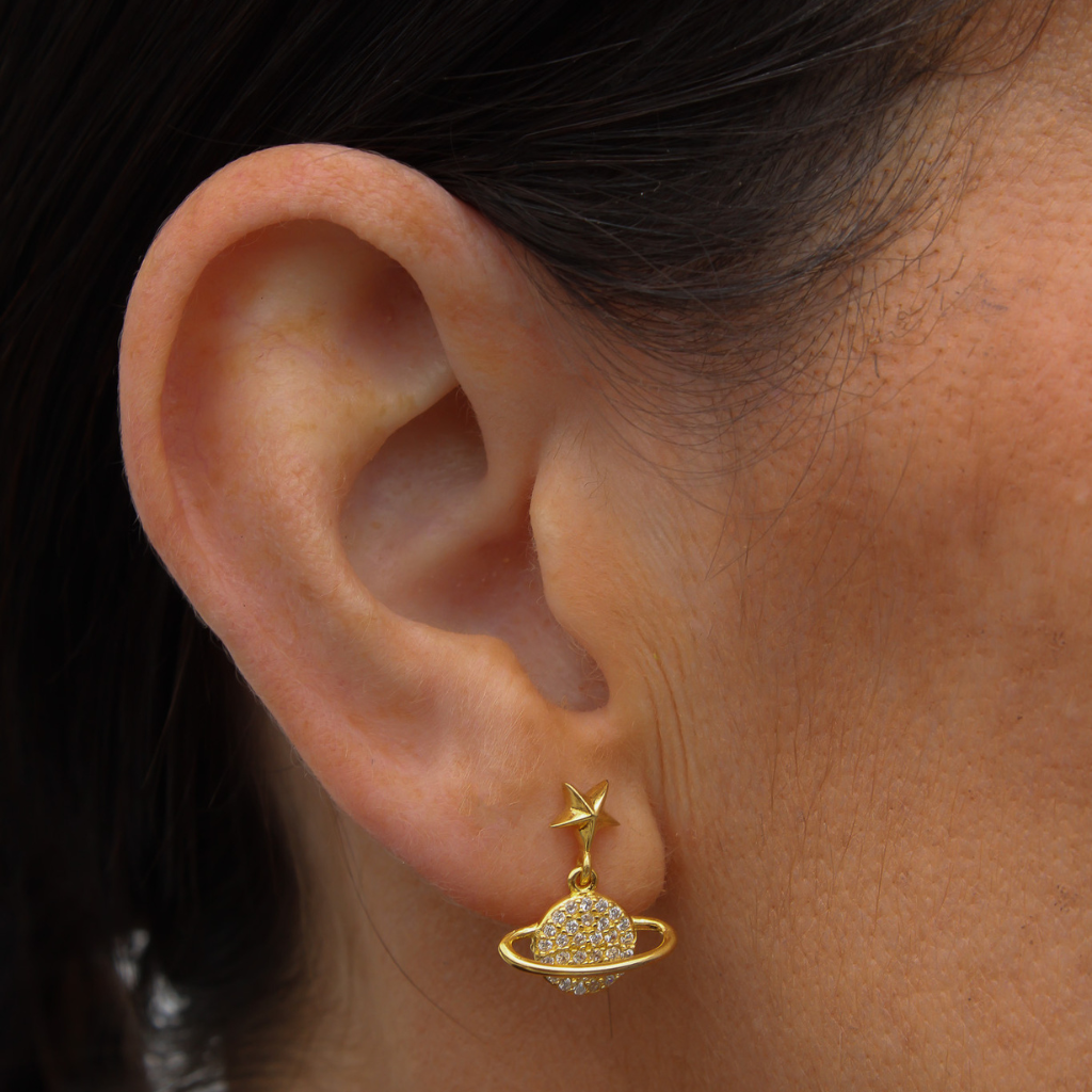 Gold stud star earrings with a drop orbit design.