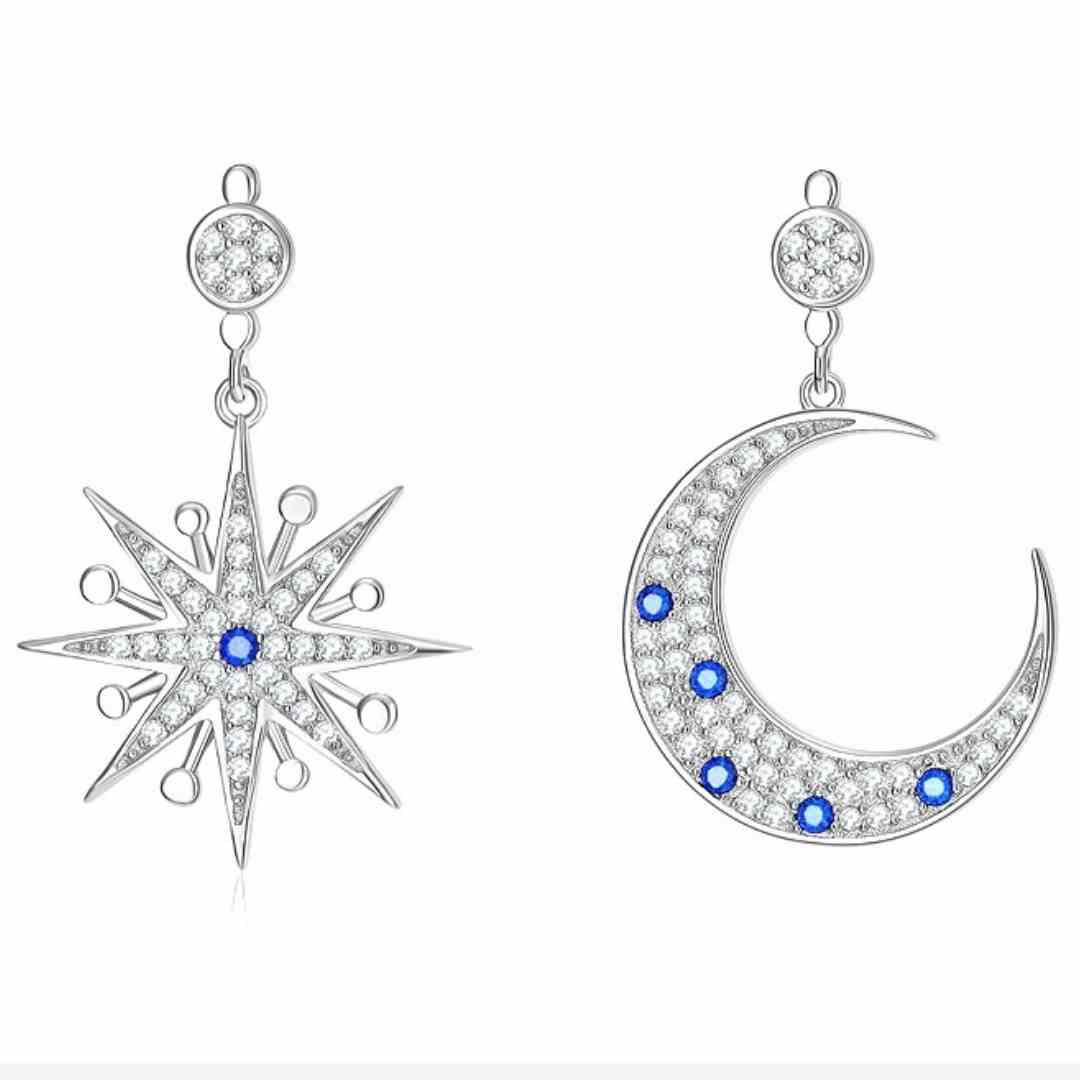 Finest quality statement sparkling sun and moon drop earrings encrusted with white and blue cubic zirconia stones 