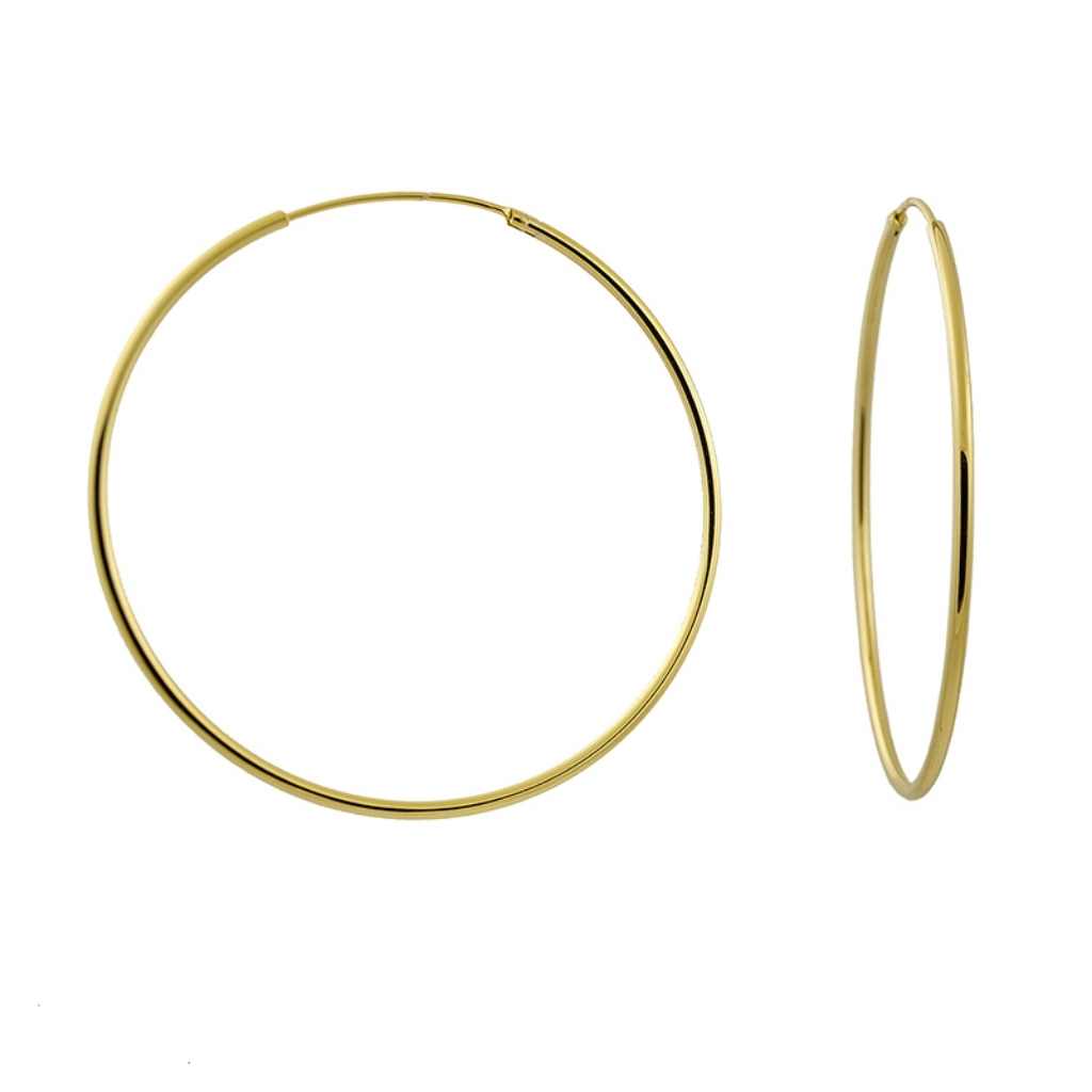 Gold big hoop earrings with a continuous fastening device.