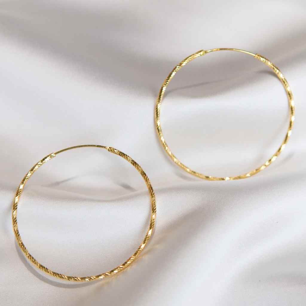 Big hoop earrings high shine finish continuous fastener.