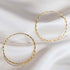 Big hoop earrings high shine finish continuous fastener.
