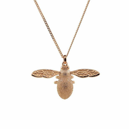Three dimensional rose gold bee necklace with intricate detail.