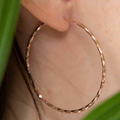 Big hoop rose gold statement earrings diamond cut.