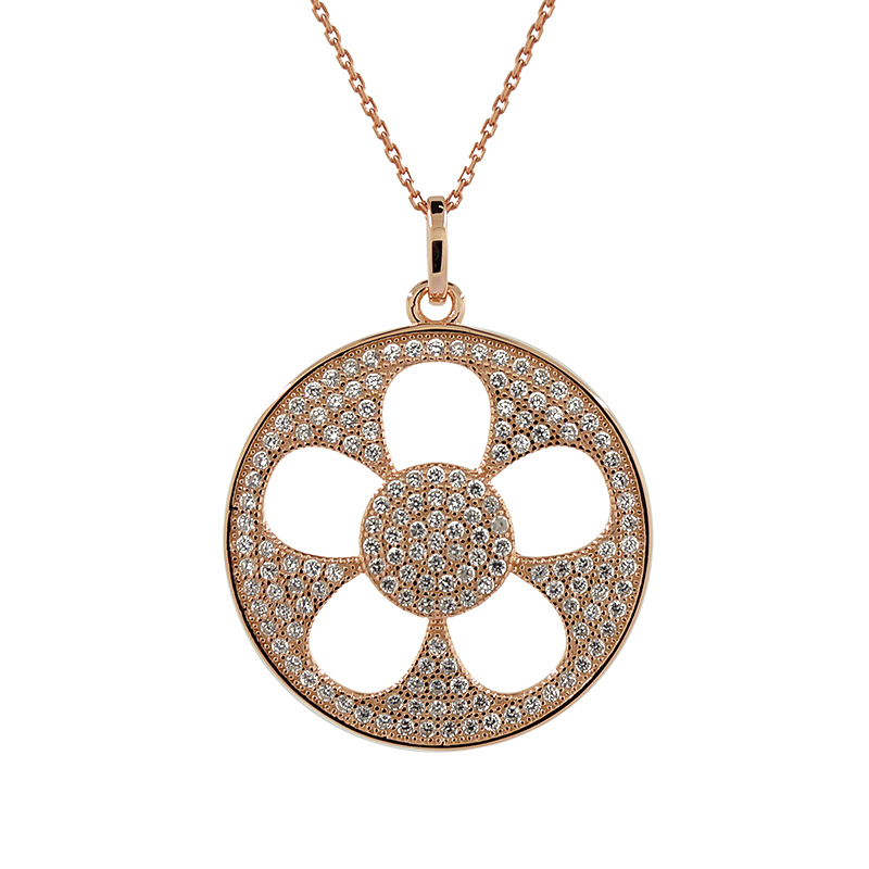 A statement necklace with a large circle charm with a cut  out flower in the centre. Encrusted with cubic zirconia stones.