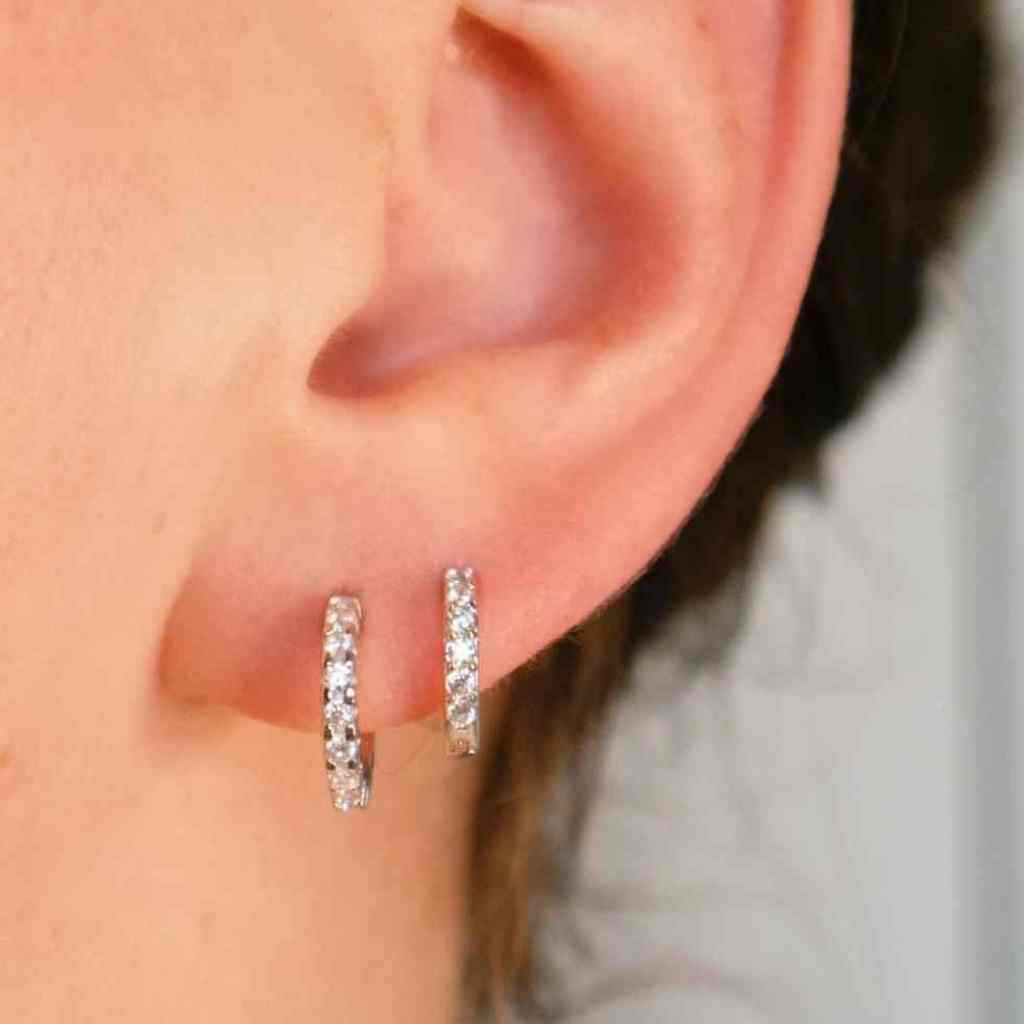 Sparkling Mini Hoop earrings made in sterling silver.