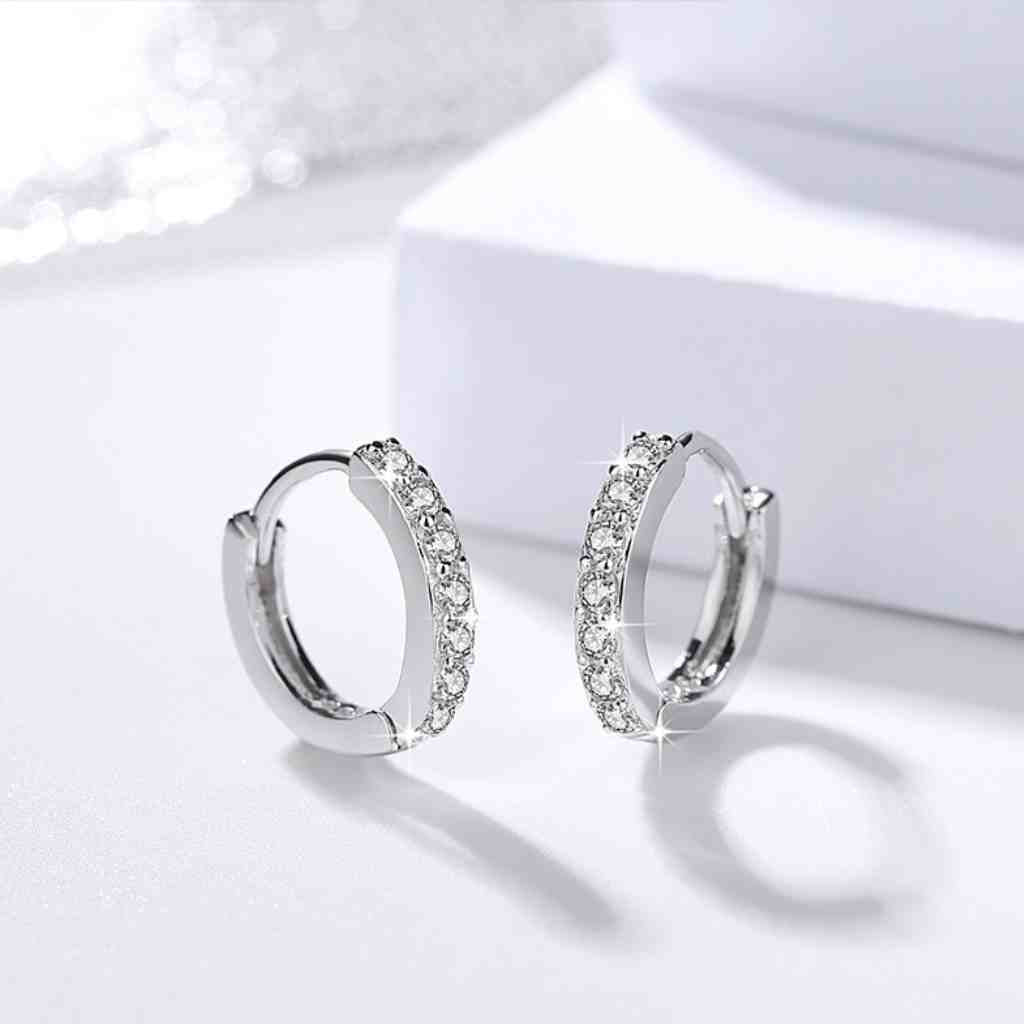 Sparkling cubic zirconia stones in a huggie hoop earrings.