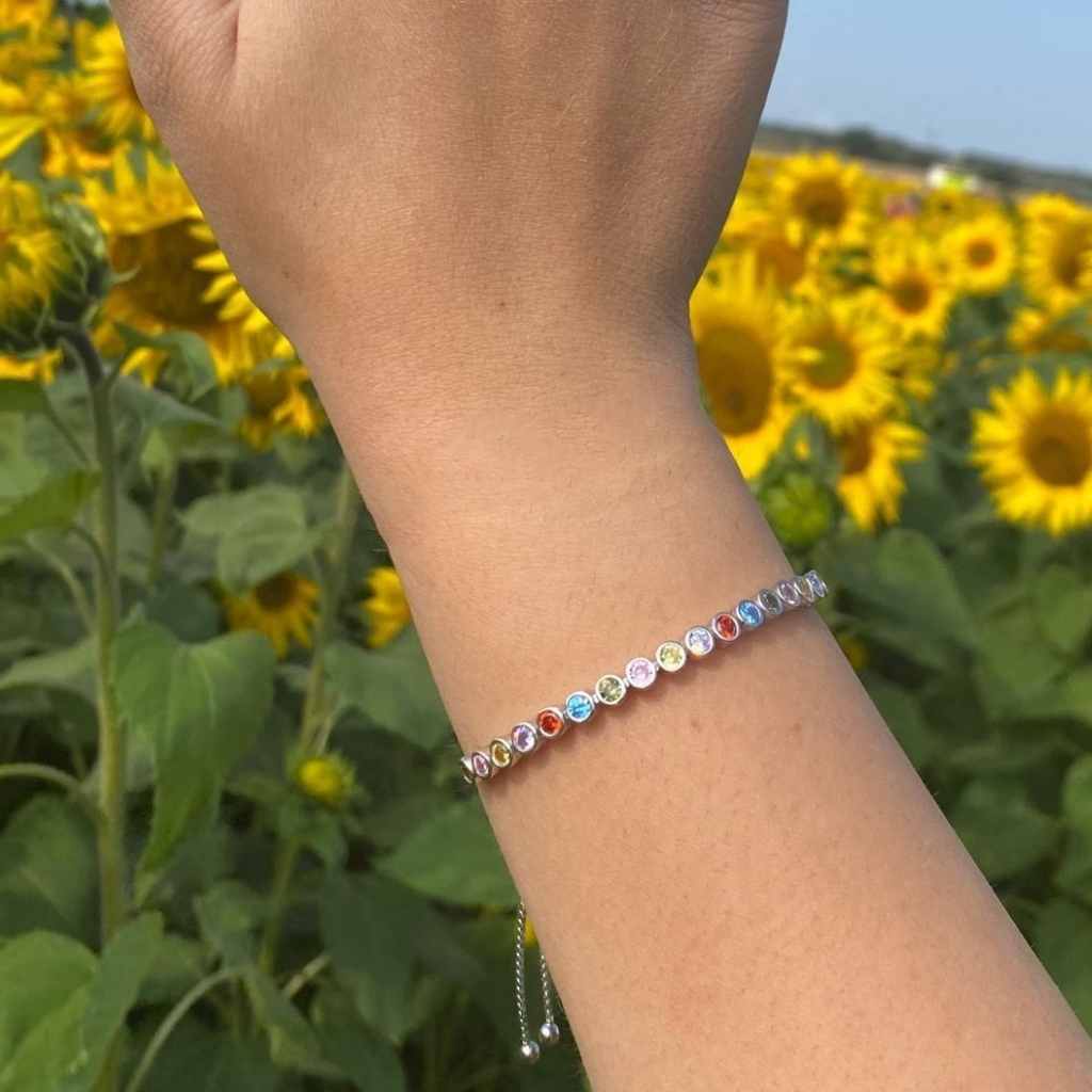 Mixed coloured circle cubic zirconia stones in a sparking tennis bracelet.