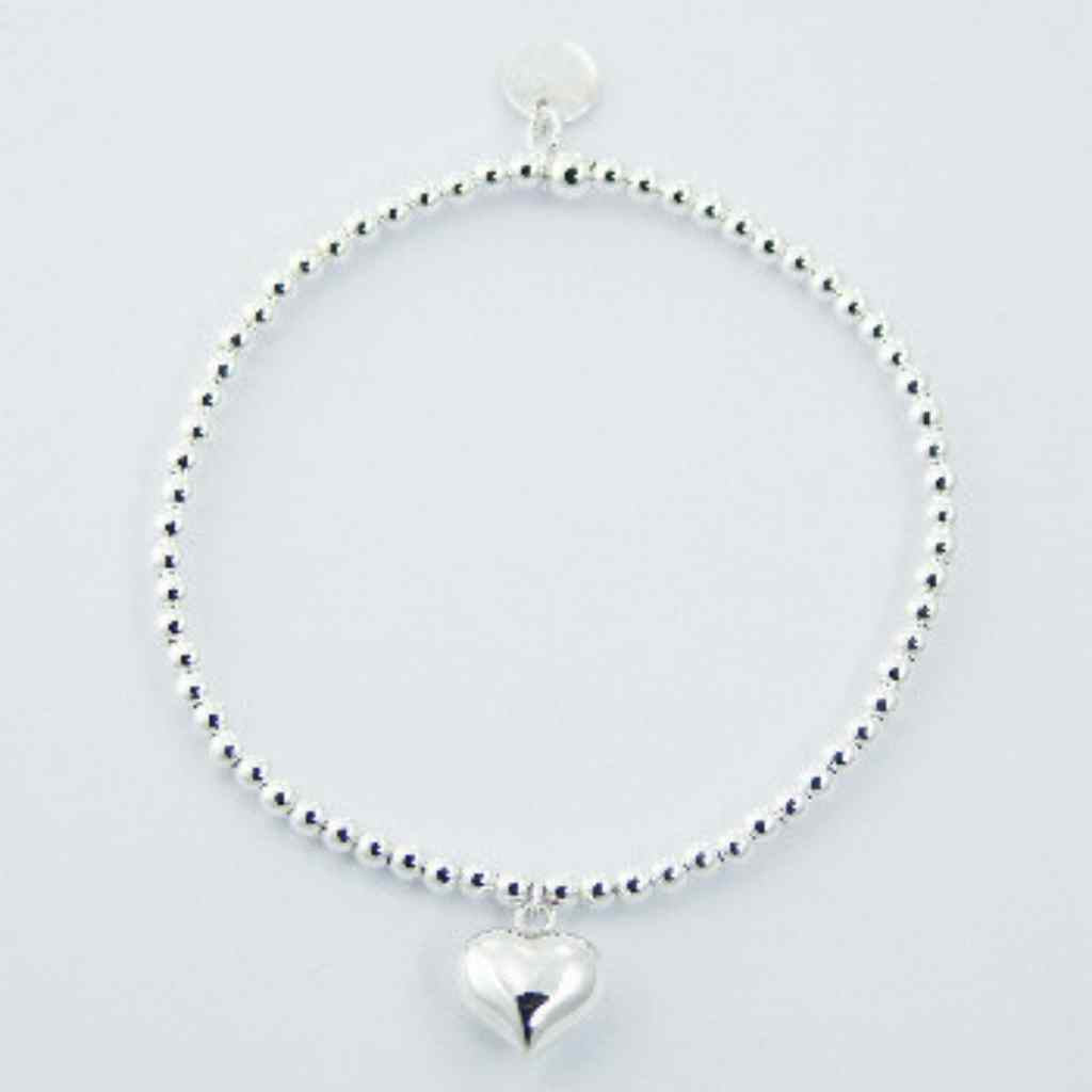 Silver bead bracelet with a puffed love heart charm.